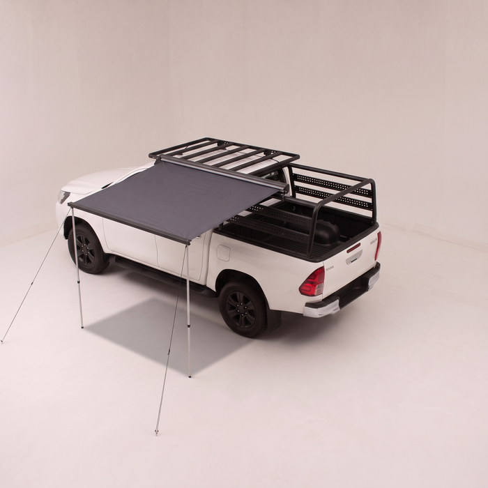 Toldo Beach Explorer abierto al costado de una Toyota Hilux
